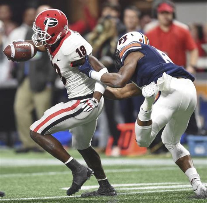 Georgia defensive back DeAndre Baker poses with NFL Commissioner Roger Goodell after the New York Giants selected Baker in the first round at the NFL football draft, in Nashville, Tenn NFL Draft Football, Nashville, USA - 25 Apr 2019