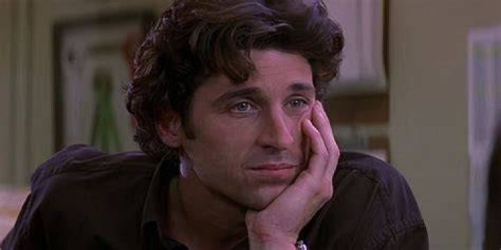 Patrick Dempsey walking on a beach